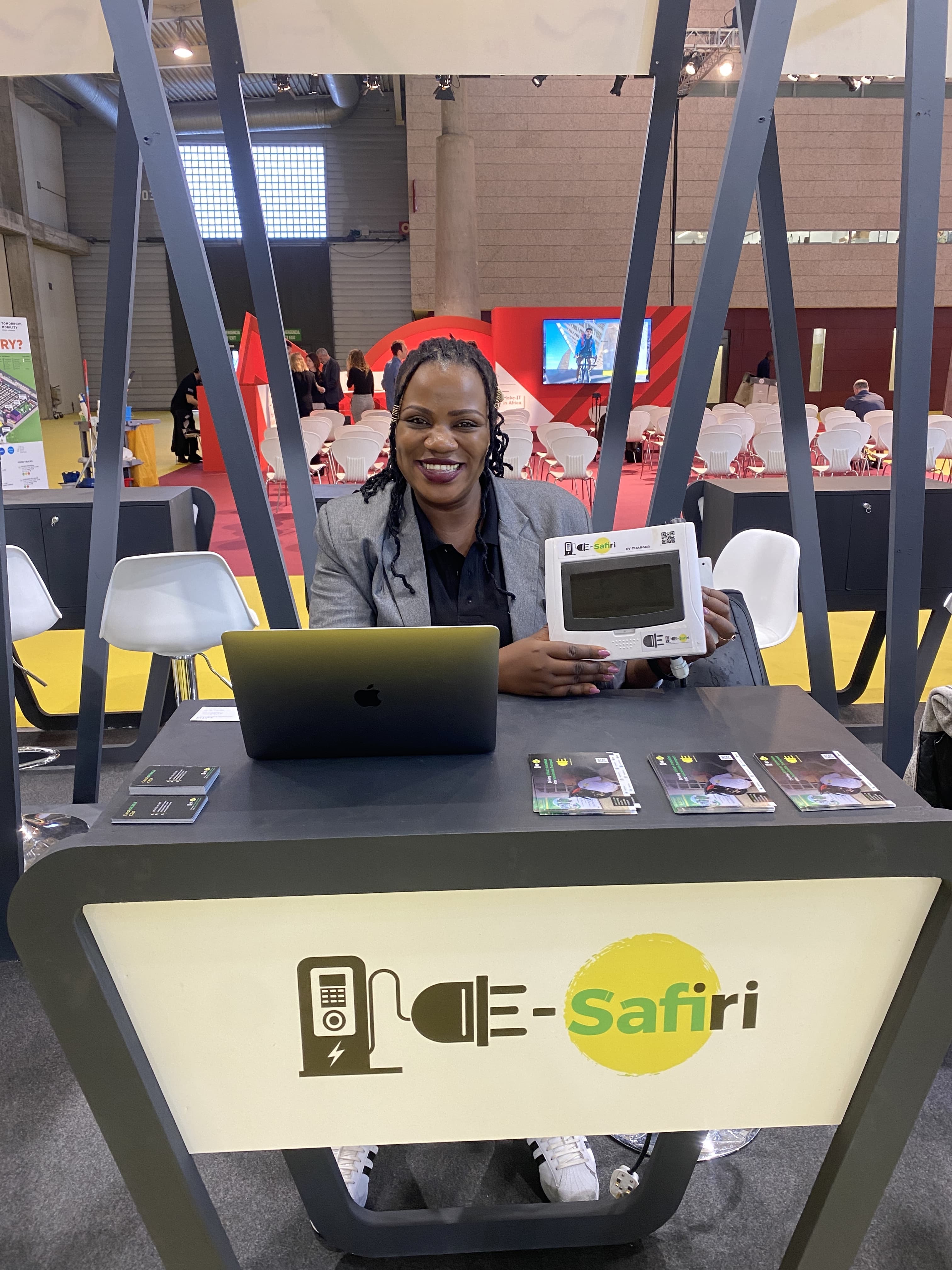 Carol showcasing an E-Safiri charging station at Smart Cities World Expo Congress (SCWEC). Barcelona, Spain. November 2022.
